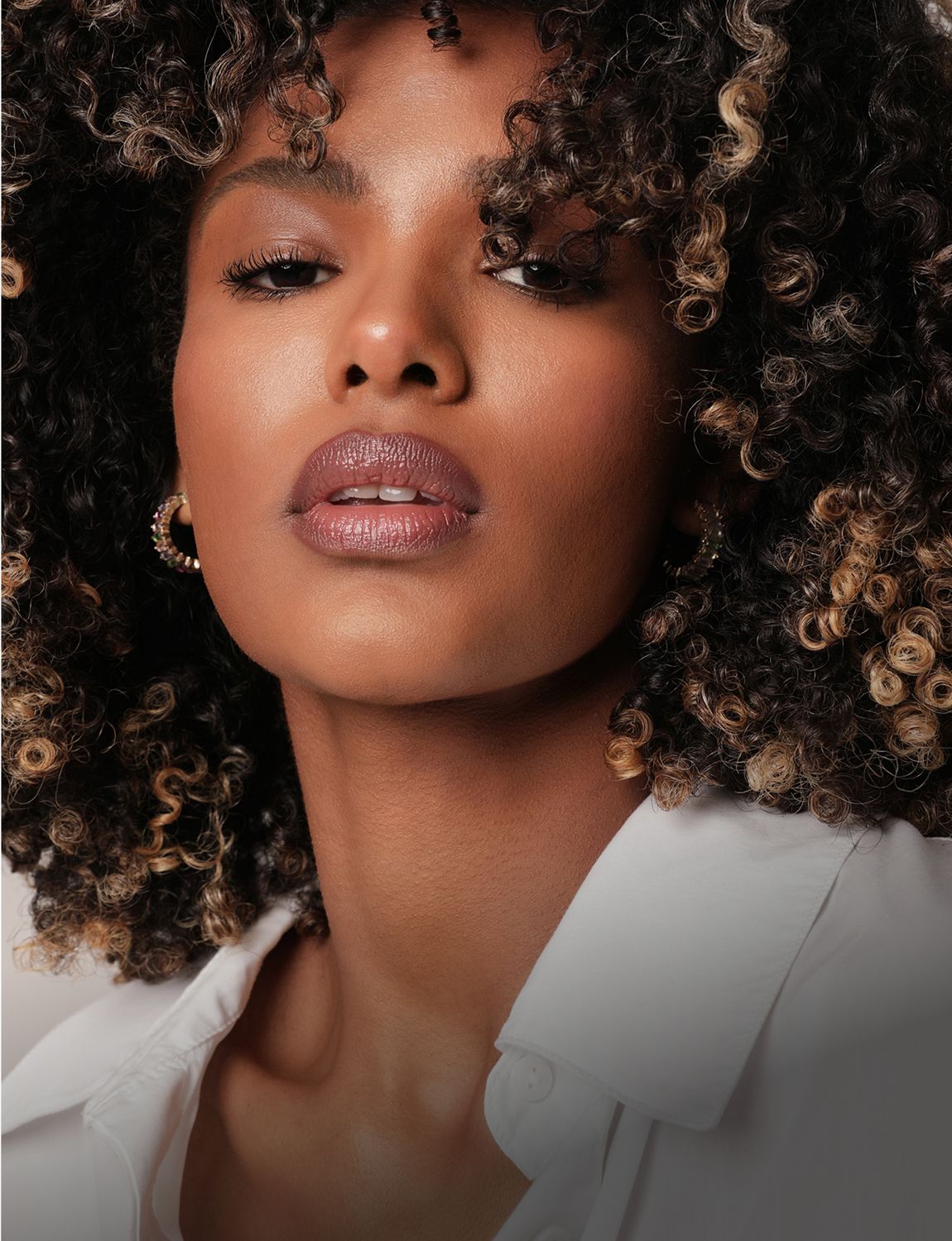 Woman in black dress with long black hair.