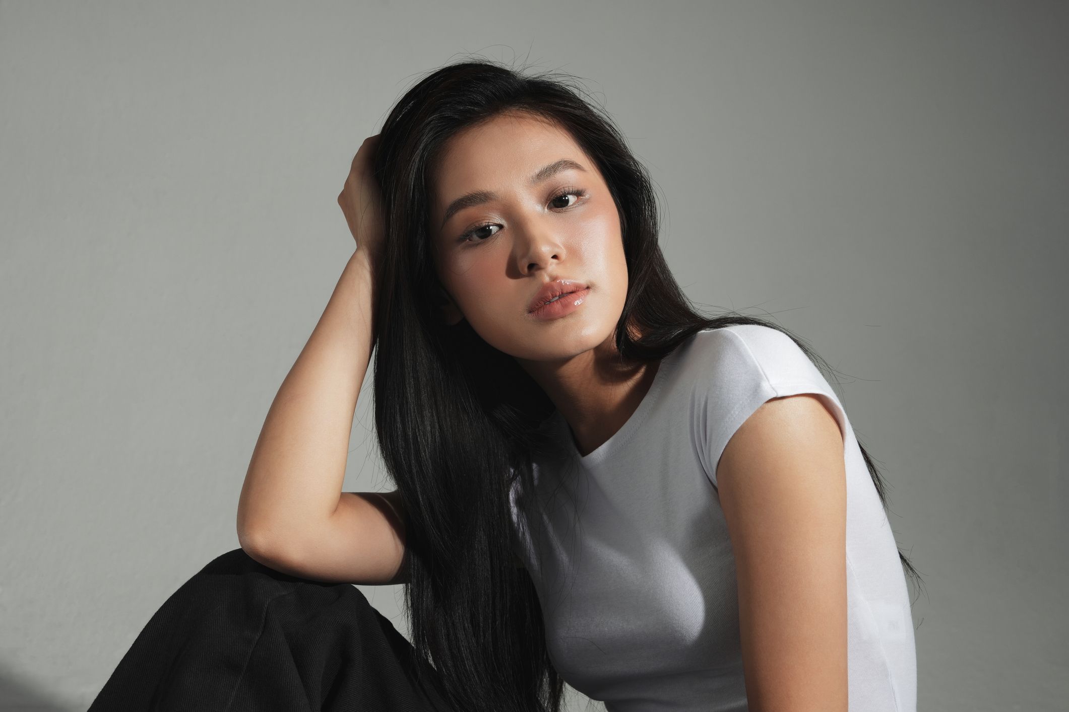 Portrait of a young woman with long hair.